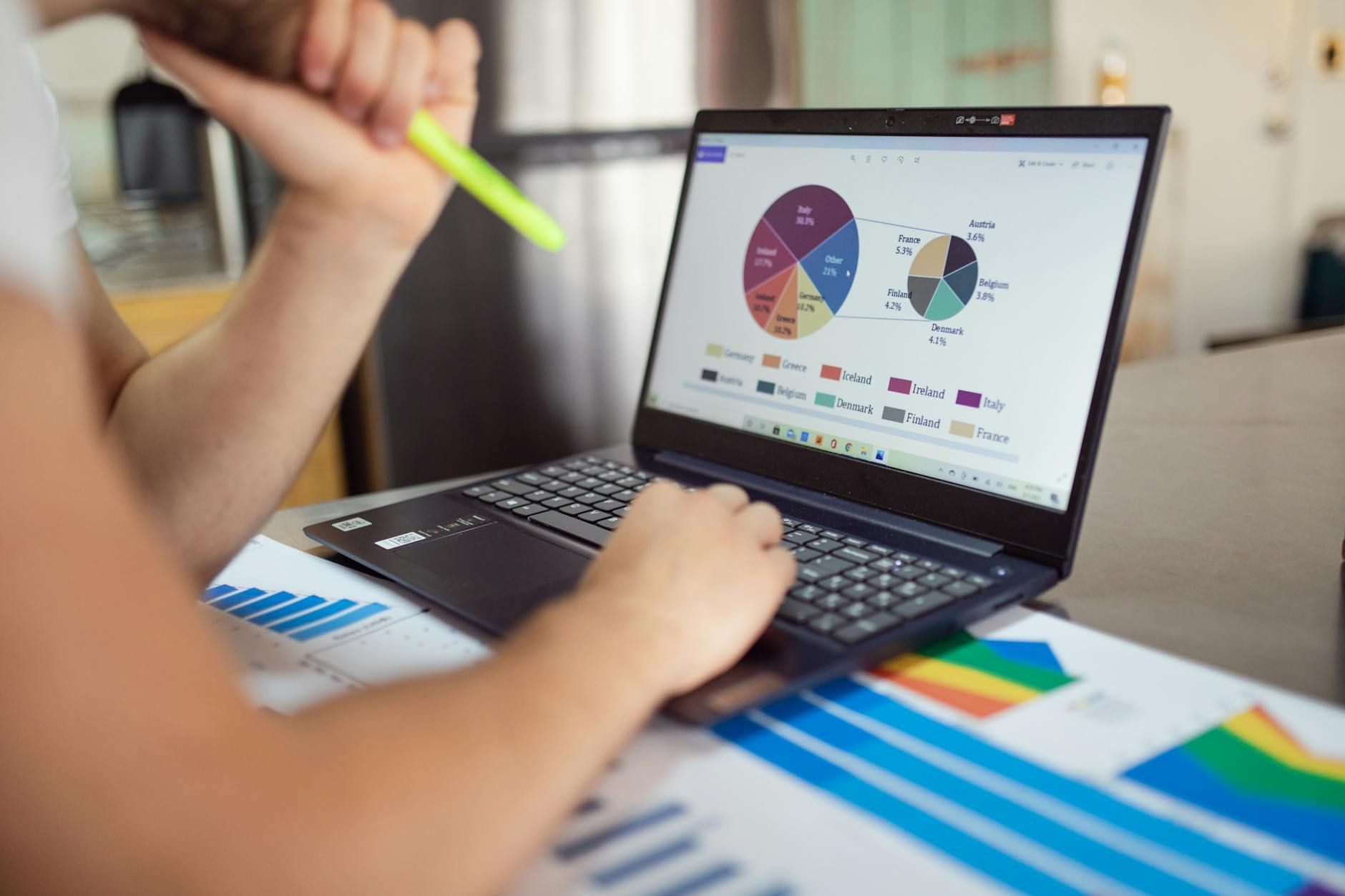 A closeup of an individual examining graphs